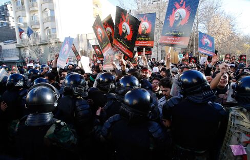 Police clash with protestors during a demonstration near the Saudi Arabian embassy in Tehran, on Jan. 3, 2016.