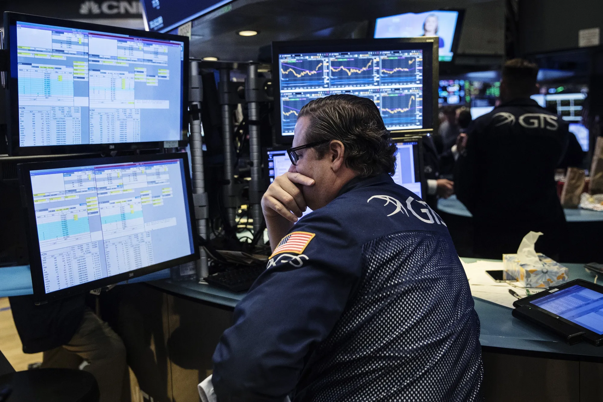 A trader works on the floor of the New York Stock Exchange.