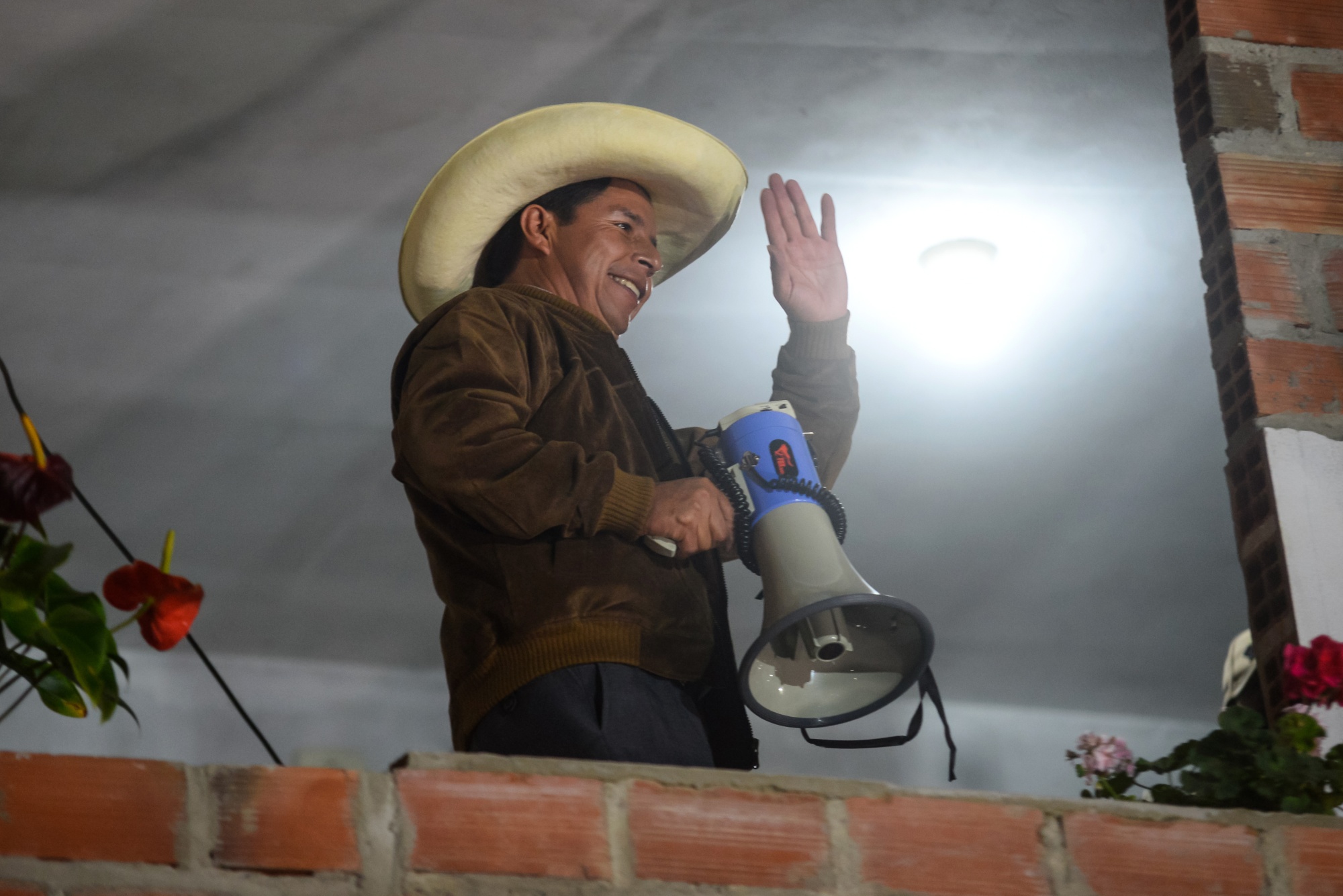 Pedro Castillo greets his supporters during a&nbsp;rally in Cajamarca, Peru, on June 6.