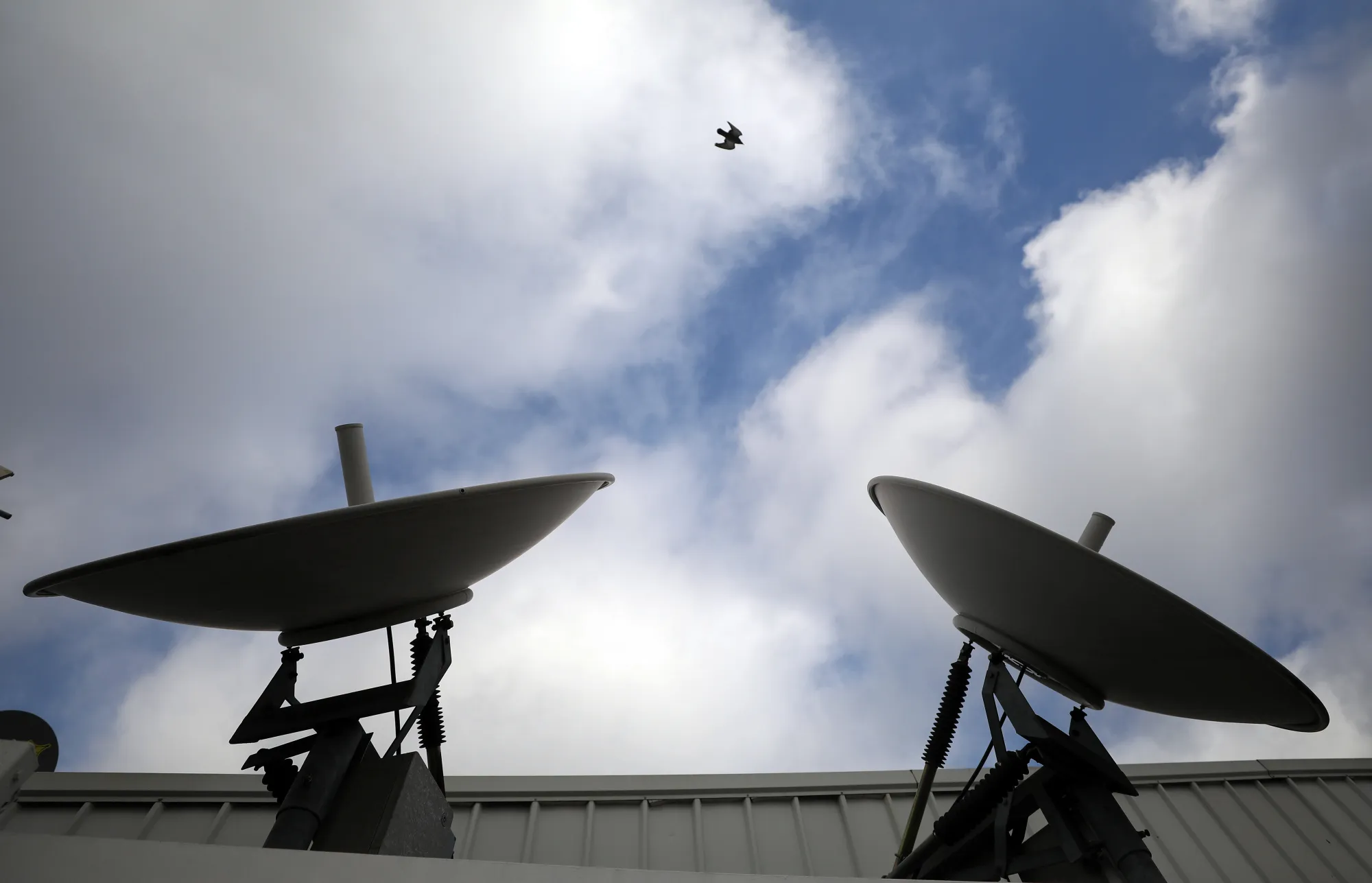 Satellite dishes on the roof of a building in London.