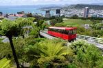 A cable car travels above the central business district in Wellington, New Zealand.