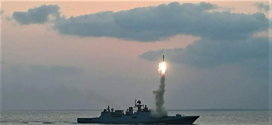 India Navy warship test fires missiles.