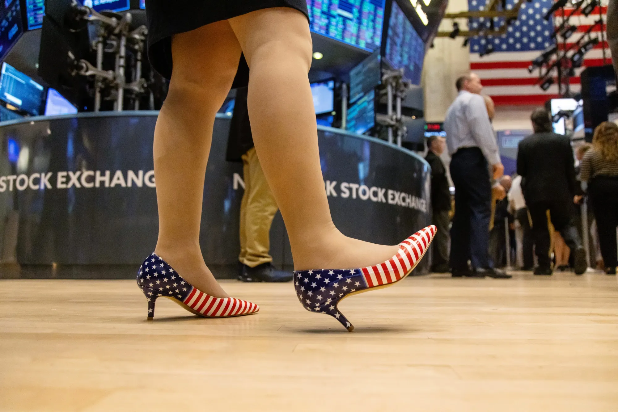 A trader wearing American flag shoes works on the floor of the New York Stock Exchange (NYSE) in New York, US, on Wednesday, Nov. 6, 2024. Donald Trump quickly put his stamp on financial markets as his victory in the US presidential election propelled "Trump Trade" plays across assets.