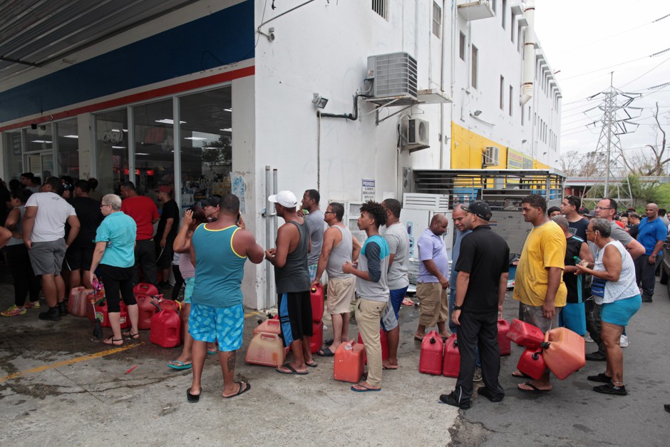 People line up to buy gasoline at a gas station in San Juan, Puerto Rico, after the area was hit by Hurricane Maria.