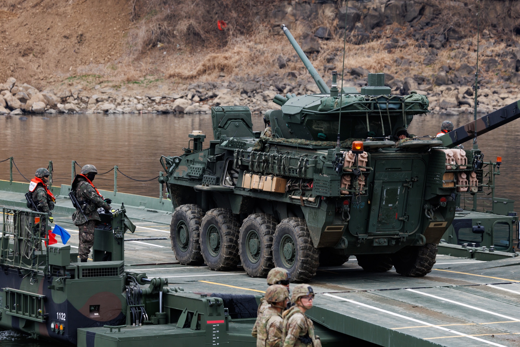 A US armored vehicle from the 2nd Infantry Division, Stryker Battalion, during the river-crossing exercises with South Korean army as part of the Freedom Shield in Yeoncheon, Gyeonggi Province, South Korea, on Saturday, March 14, 2026. North Korea fired about 10 ballistic missiles on Saturday, Yonhap News agency reported, citing South Korea’s Joint Chiefs of Staff, days after leader Kim Jong Un oversaw a second test this week of cruise missiles from the country’s newest warship. Photographer: SeongJoon Cho/Bloomberg