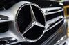 A logo sits on the front grille of a Mercedes-Benz AG GLC300 automobile on the production line at the Valmet Oyj automotive plant in Uusikaupunki, Finland, on Wednesday, May 25, 2017. The plant is being hailed as a symbol of Finland’s economic comeback after it secured a contract to produce Mercedes’ GLC sports utility vehicle, boosting employment to as much as 3,800 workers -- a record.