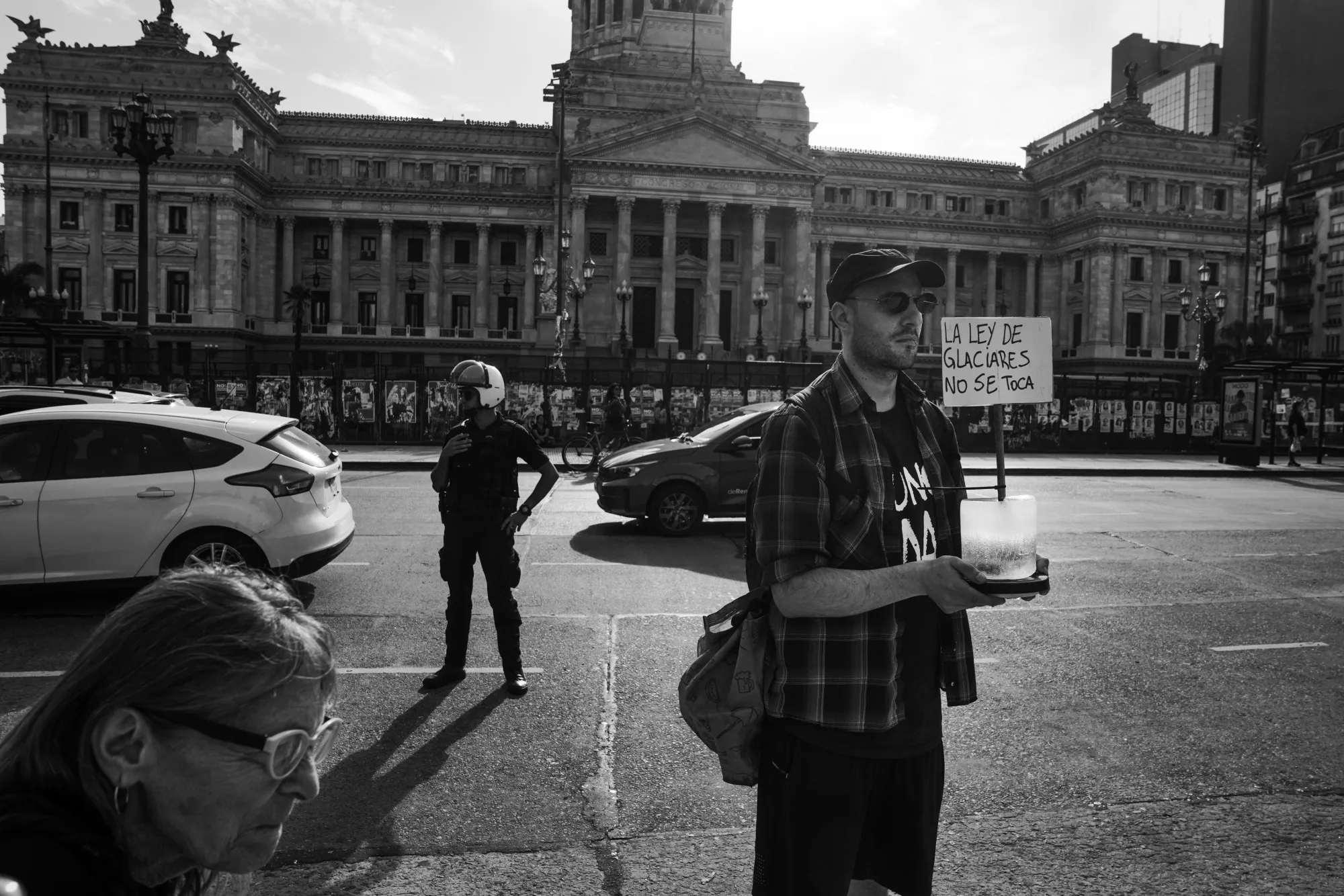 A demonstrator holds a sign that reads, in Spanish, "The Glacier Law Is Not To Be Touched" during a protest in Buenos Aires, on Feb. 25.