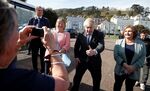 Boris Johnson poses for photos as he campaigns in Llandudno, Wales on April 26.