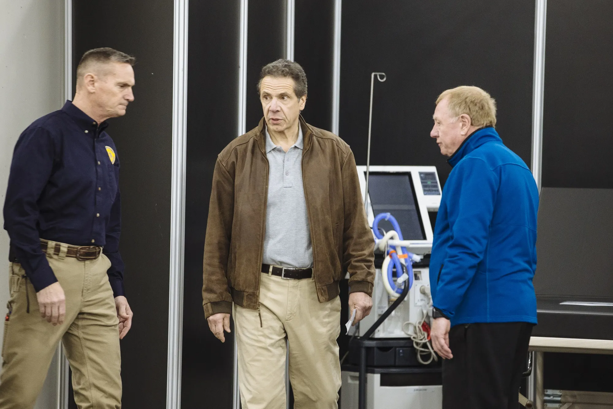 Andrew Cuomo, center, tours an example of a makeshift hospital room at the Jacob K. Javits Convention Center in New York on March 23.