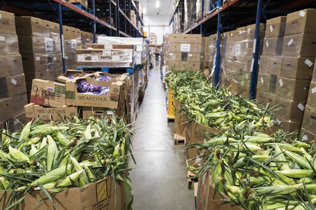 Boxes of corn are sorted in the refrigerated unit at the headquarters of hunger-relief group Second Harvest Heartland in Brooklyn Park, Minnesota, on July 23, 2020. 