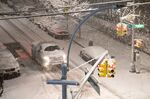 Cars are stopped by the roadside during a snowfall on January 7, 2022 in New York City.