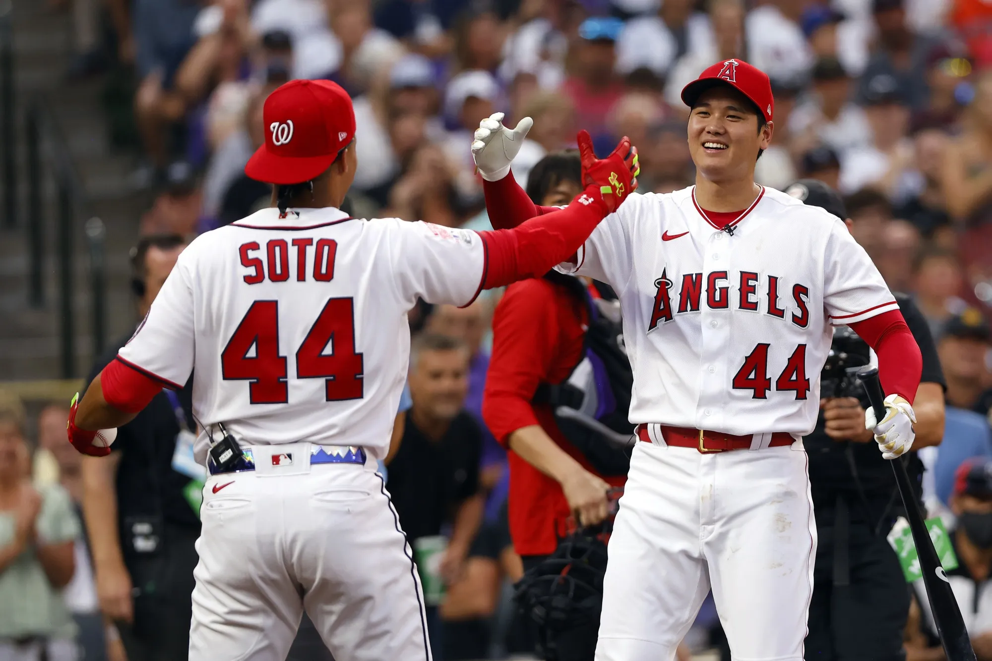 Juan Soto and Shohei Ohtani hi-five each other during a game in 2021, when they were&nbsp;on their old teams.