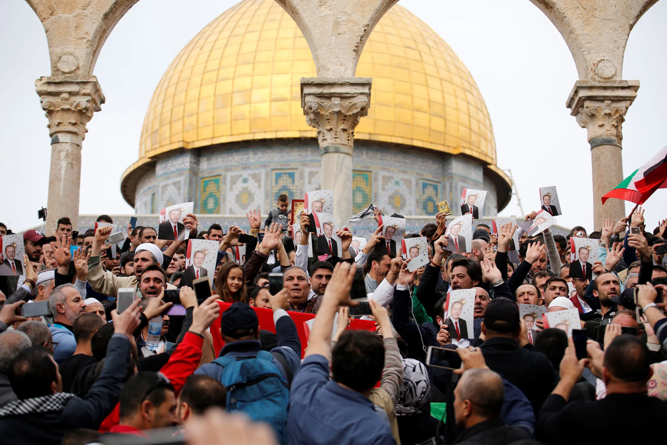 Palestinians hold up images of Recep Tayyip Erdogan during a demonstration in Jerusalem in 2017.