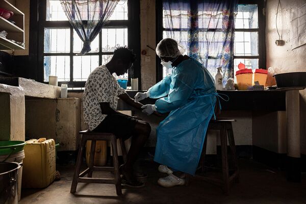 Readying to draw blood for testing at a hospital in Mongbwalu on May 20.