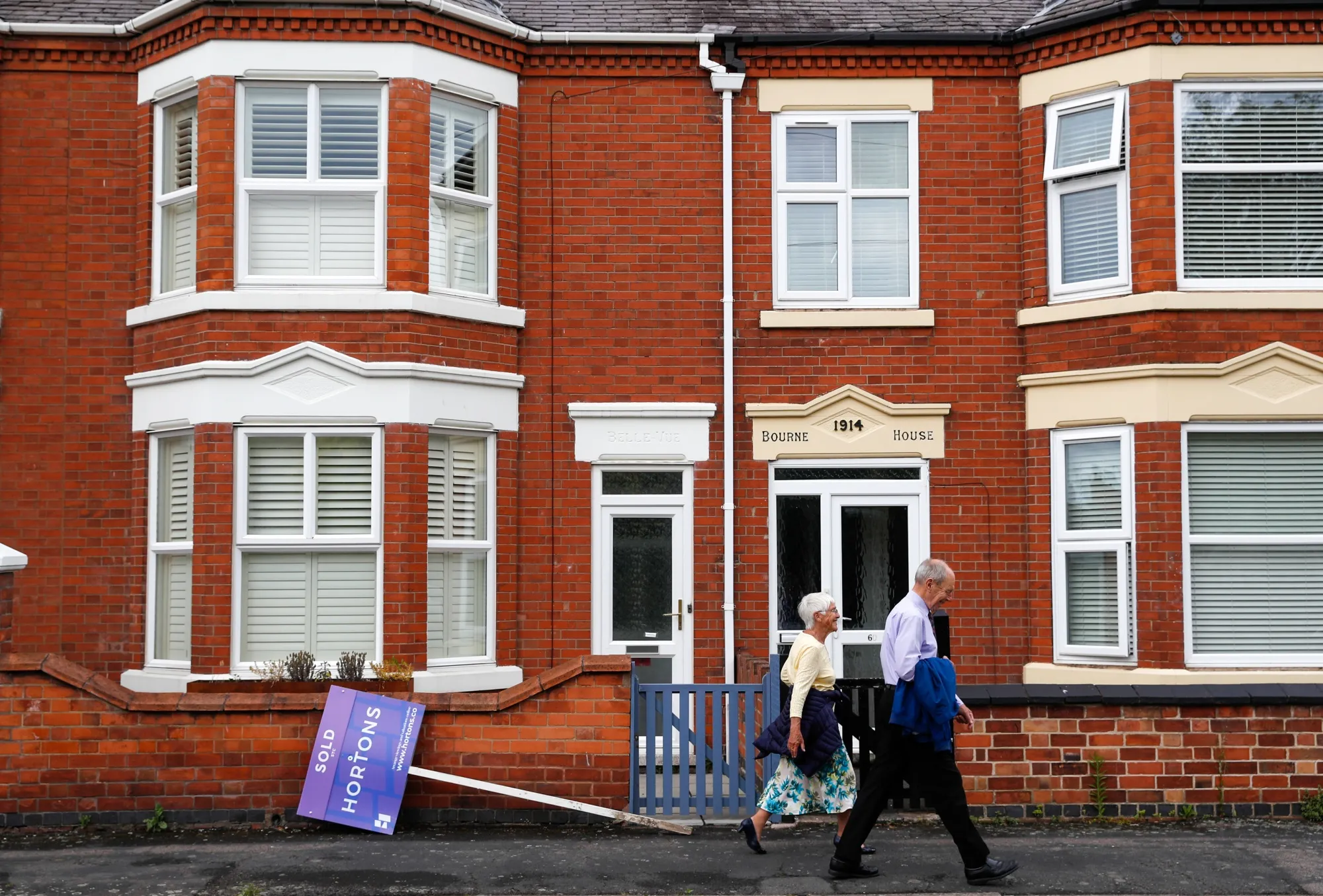 An Estate Agents "sold" sign on the floor outside a property in Loughborough, U.K.