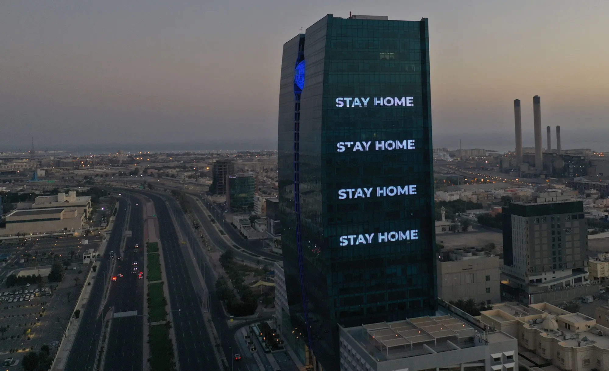 "Stay Home" is displayed on a tower during the coronavirus pandemic in Jeddah.