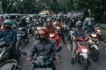 Motorists wait in traffic in Pancoran, South Jakarta, Indonesia.