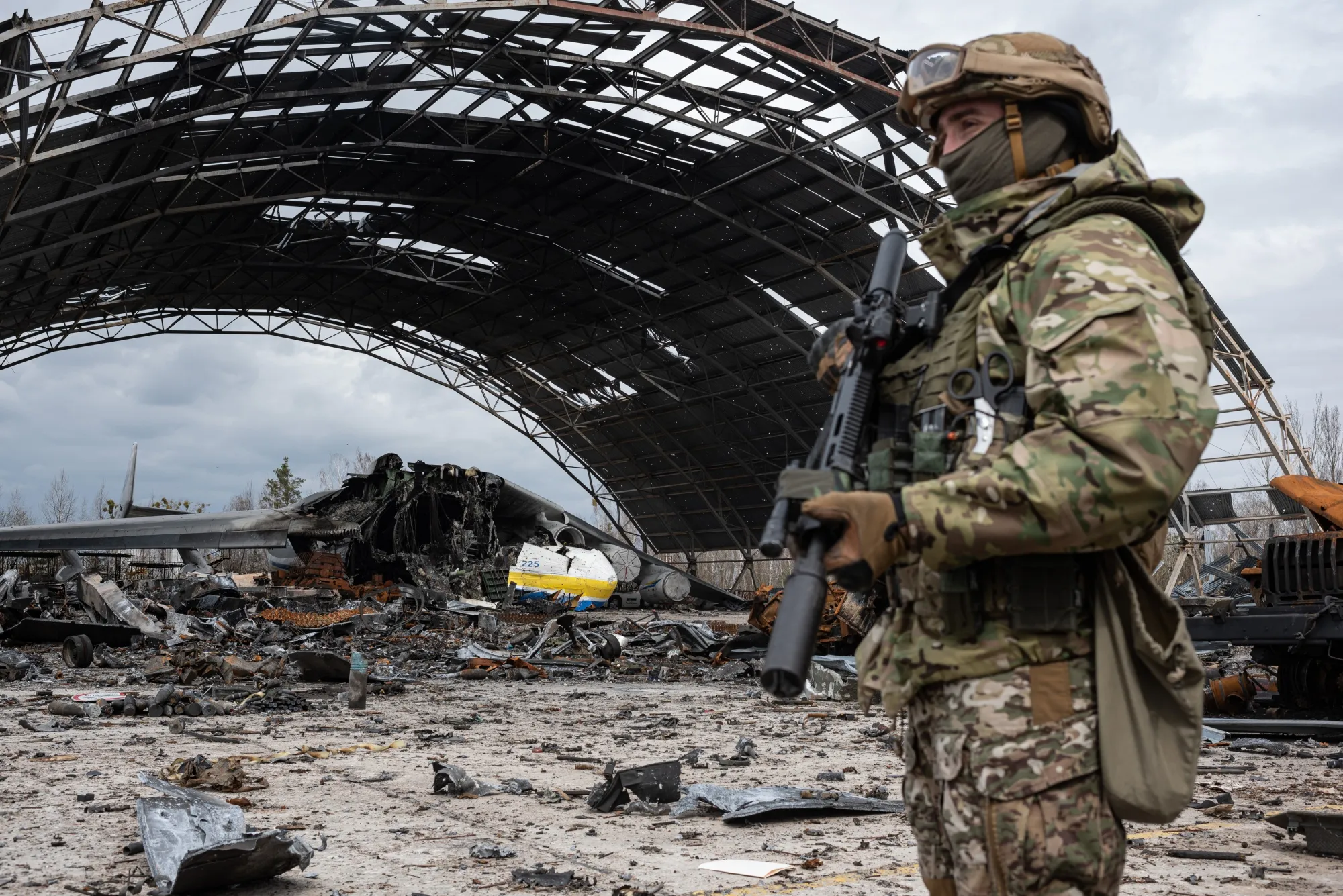 A Ukrainian serviceman near the destroyed Ukrainian Antonov An-225 cargo aircraft at Hostomel airfield, Ukraine, on April 8.