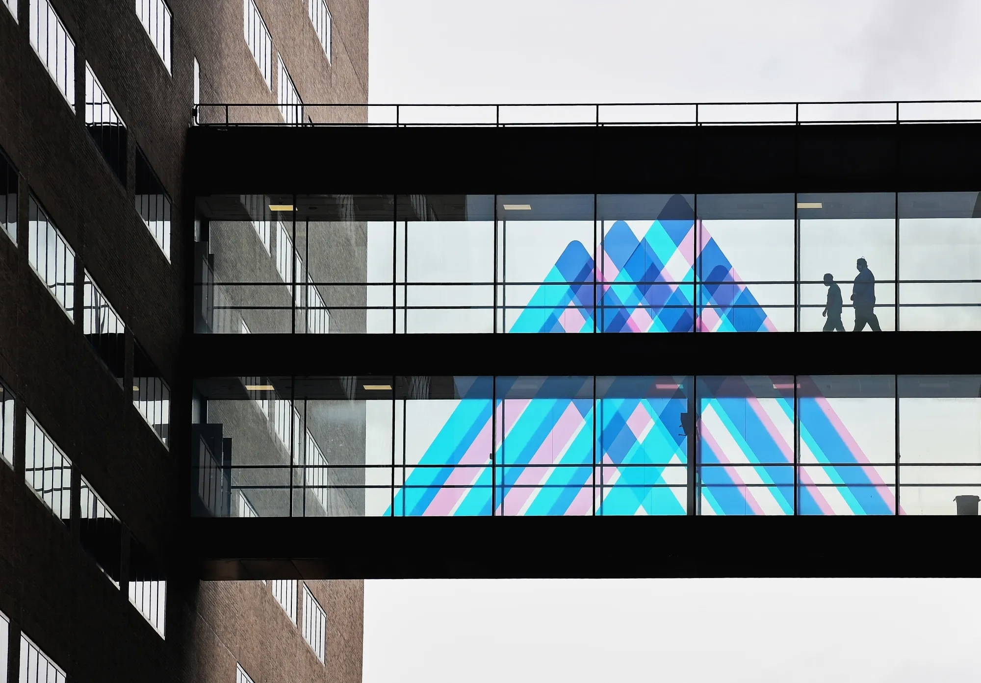 People cross a bridge at a Mt. Sinai Hospital in New York.