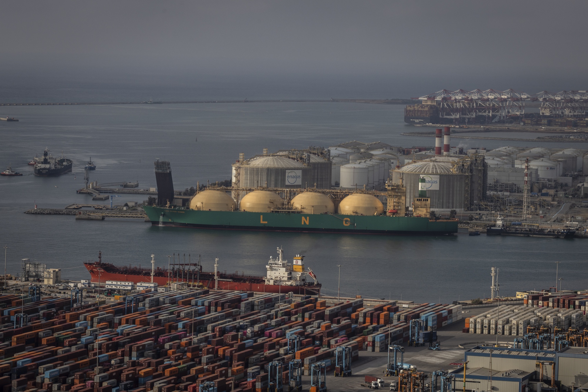 The liquified natural gas (LNG) tanker LNG River Niger, top, at the port of Barcelona, Spain, on Thursday, April 30, 2026. After weeks of fuel inflation across Asia and Europe, higher pump prices are now starting to intensify in the US as war-driven energy shocks show little sign of abating.