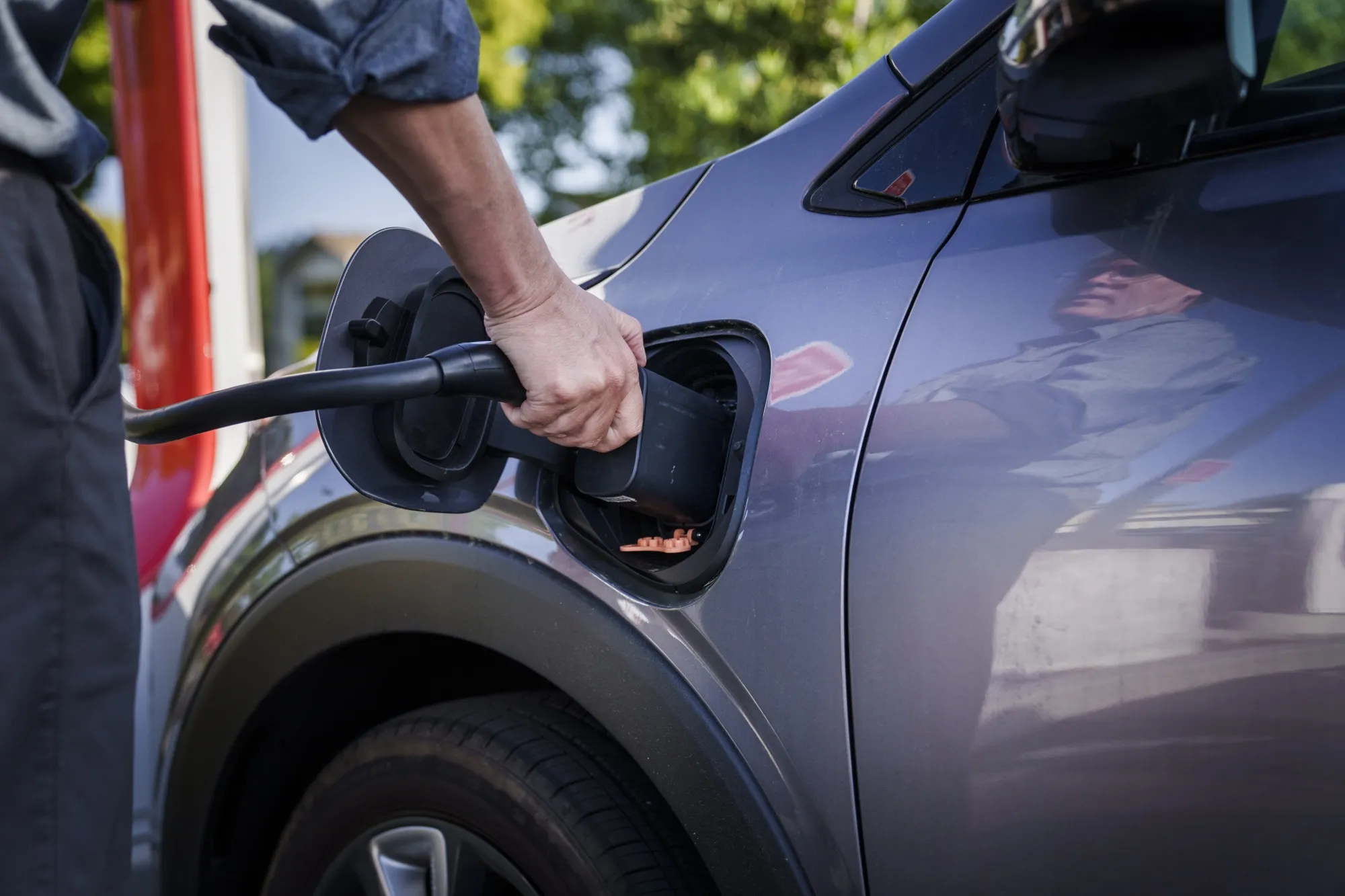 A driver charging&nbsp;a Chevrolet&nbsp;Bolt electric vehicle at a Tesla Supercharger in Scotts Valley, California.