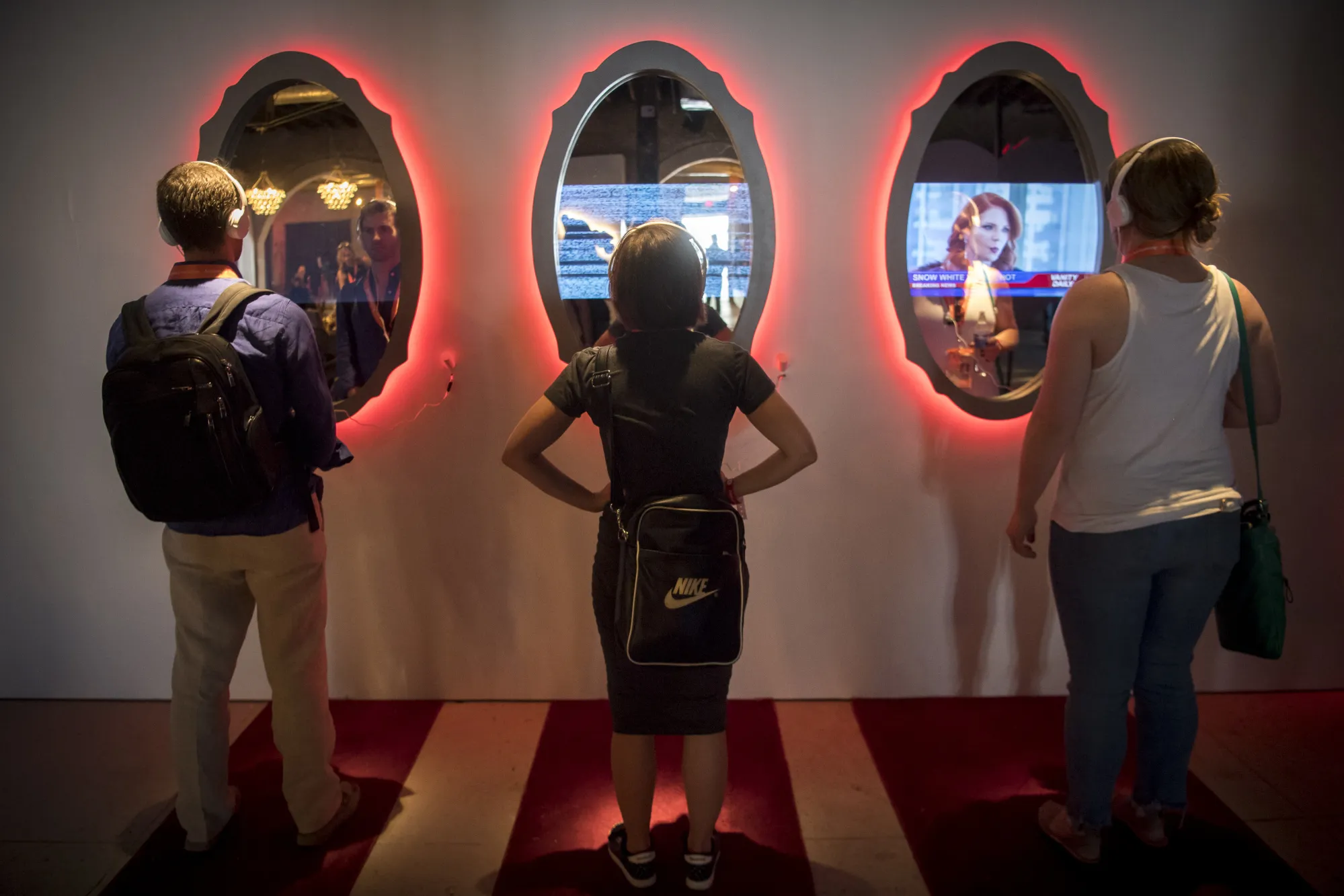 Attendees view the YouTube Inc. story exhibit during the South By Southwest (SXSW) conference in Austin, Texas, U.S., on Saturday, March 10, 2018.