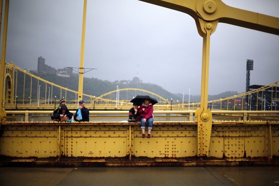 People gather on the Andy Warhol bridge over the Allegheny River in downtown Pittsburgh.