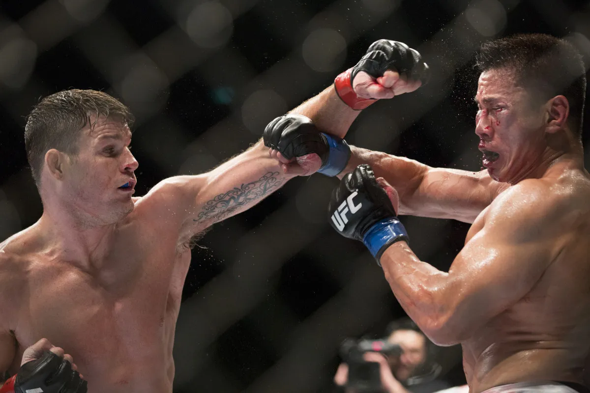 Micheal Bisping, left, punches Cung Le during Ultimate Fighting Championship (UFC) Fight Night at Cotai Arena.