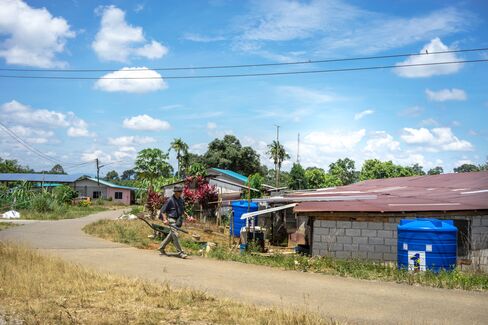 Blue water tanks in Lebor village near Serian.