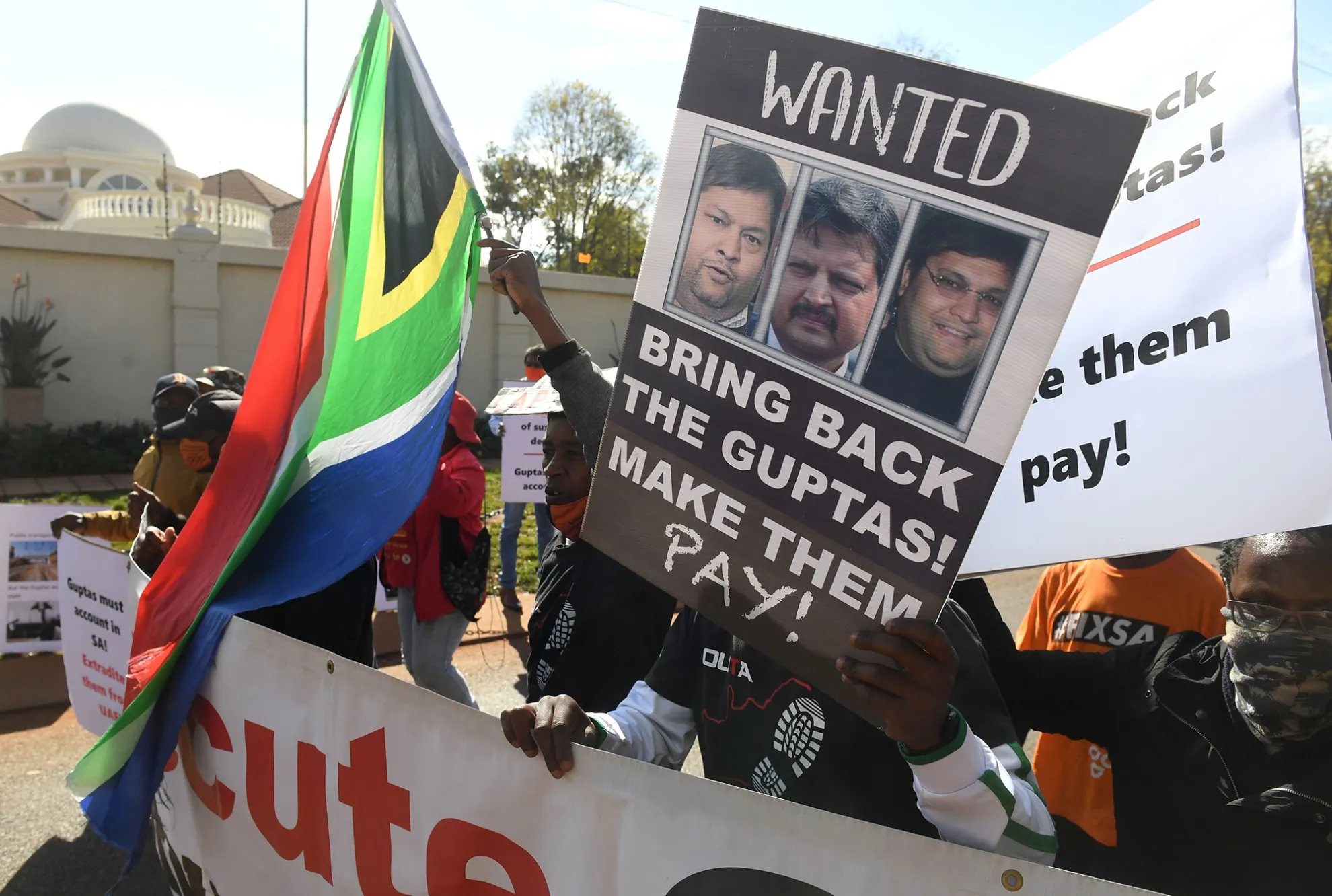 Demonstrators call&nbsp;for the extradition of the Gupta brothers in Pretoria,&nbsp;on June 10, 2021.&nbsp;