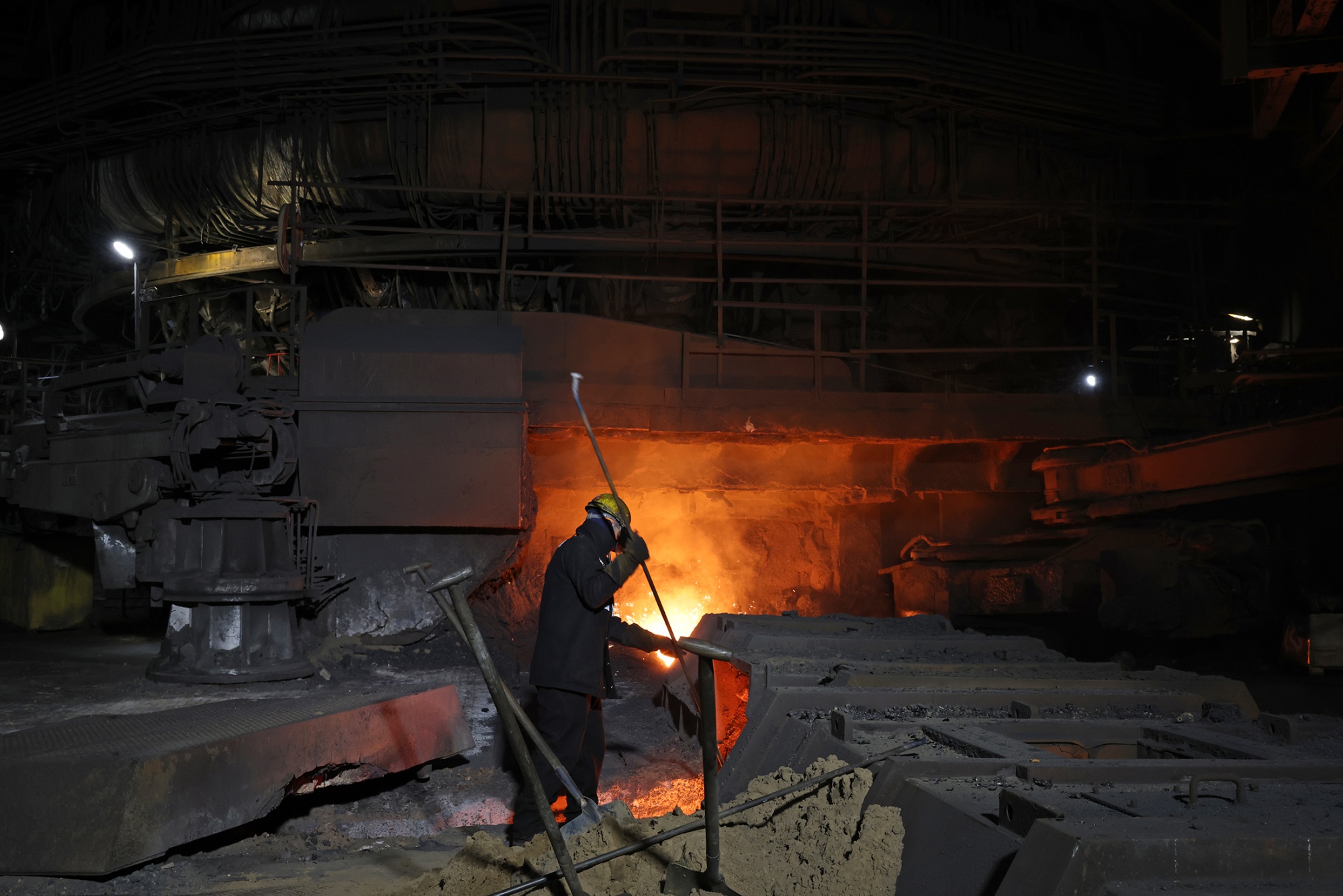 SCUNTHORPE, ENGLAND - APRIL 15: A worker works at one of the Blast Furnaces at British Steel&#39;s steelworks site during a visit from Britain&#39;s Business, Energy and Industrial Strategy Secretary Jonathan Reynolds on April 15, 2025 in Scunthorpe, northern England. Britain&#39;s government raced to secure raw materials to keep the country&#39;s last steelmaking blast furnaces running, as Beijing warned the UK against politicising the takeover of Chinese-owned British Steel. (Photo by Darren Staples - WPA Pool&#x2F;Getty Images) Photographer: WPA Pool&#x2F;Getty Images Europe