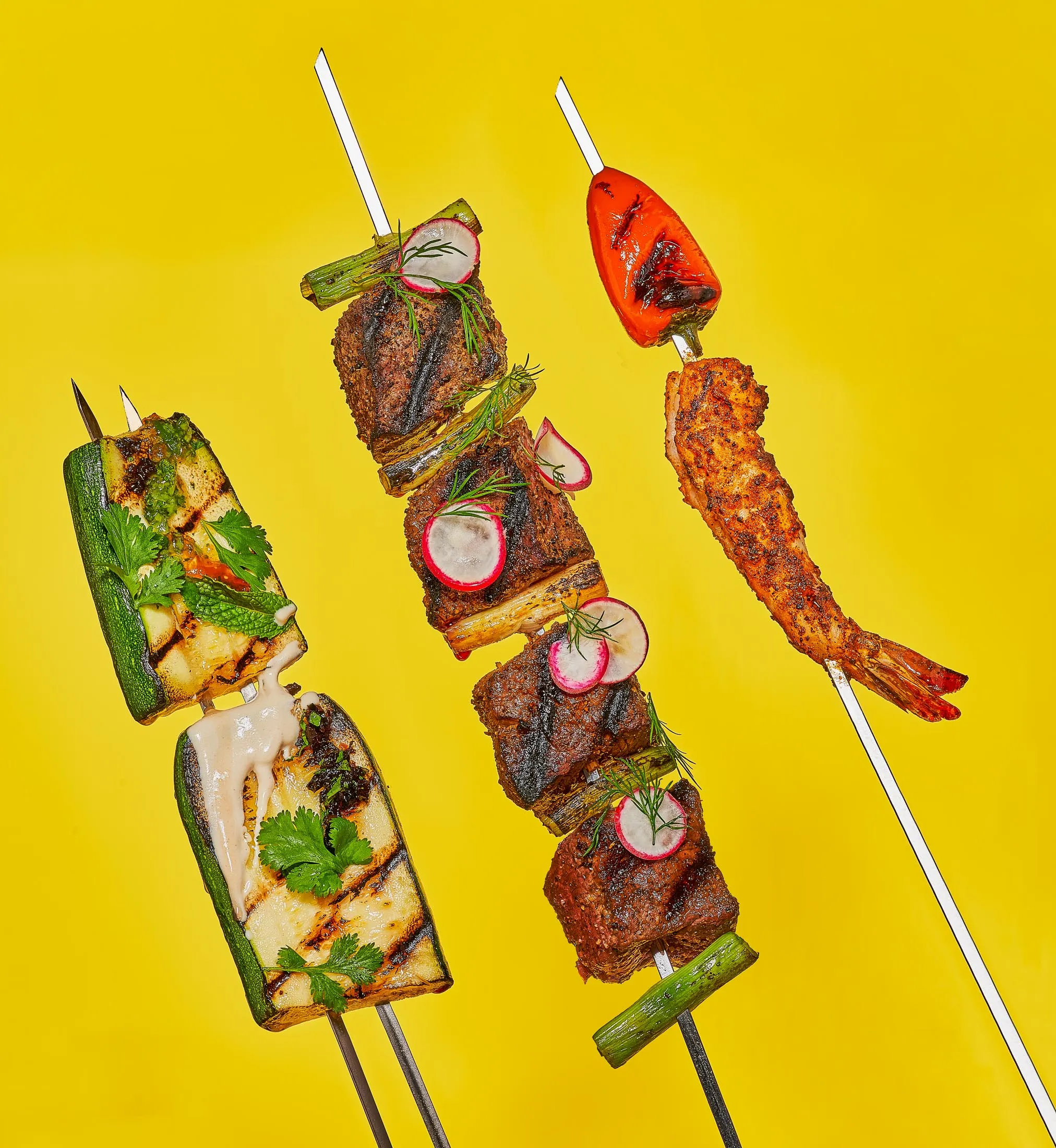 Skewers, from left: zucchini with tahini, wagyu with onion, and harissa shrimp with pepper.