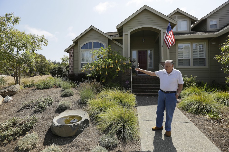 Homeowner Bill Crowell shows off his garden, designed to use less water, at his home in Santa Rosa, California.