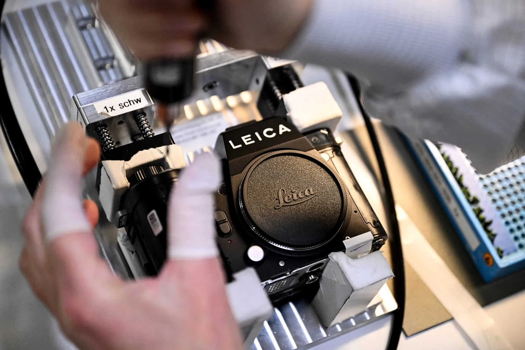 An employee assembles a Leica camera at the Leica factory in Wetzlar, Germany.