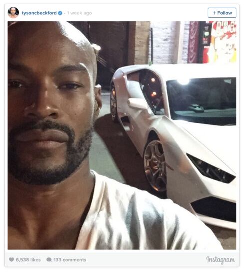 Tyson Beckford takes a selfie with a Lamborghini.