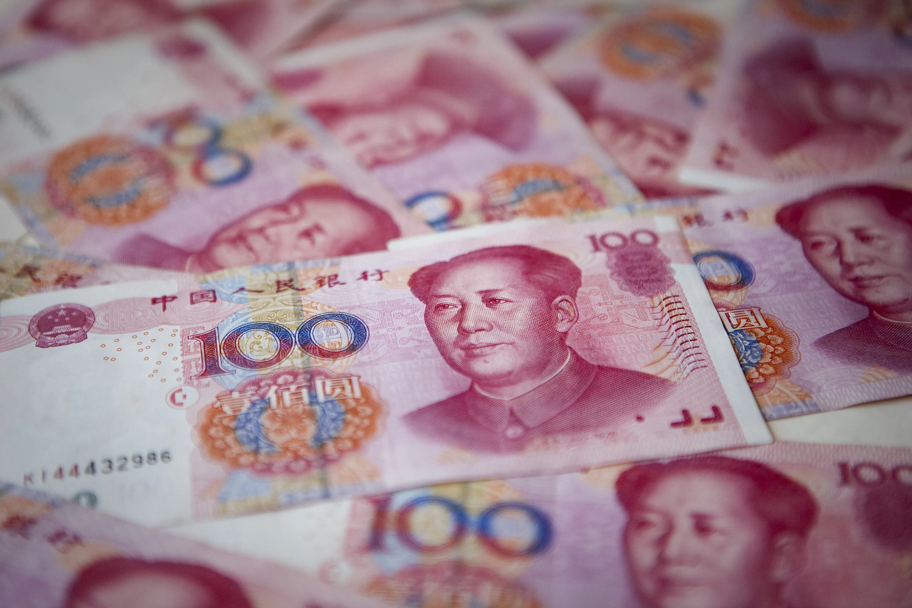 One-hundred-yuan bank notes are arranged for a photograph in Beijing.
