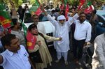 Pakistan Tehreek-e-Insaf party activists&nbsp;during a protest against the arrest of PTI supporters ahead of a major sit-in planned by Imran Khan, in Lahore on May 24.