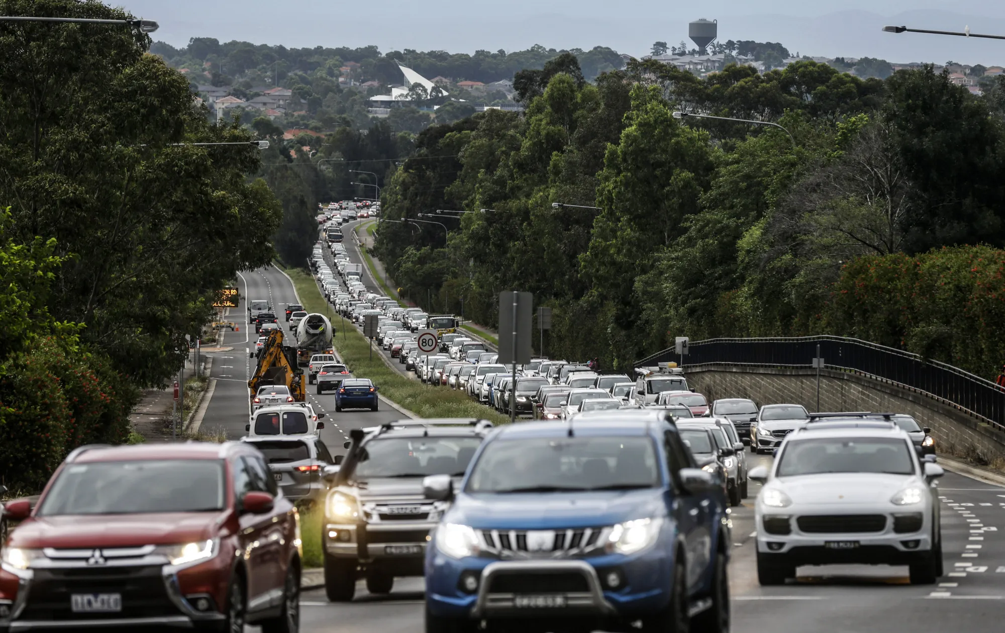 Vehicles drive along in Sydney, Australia.