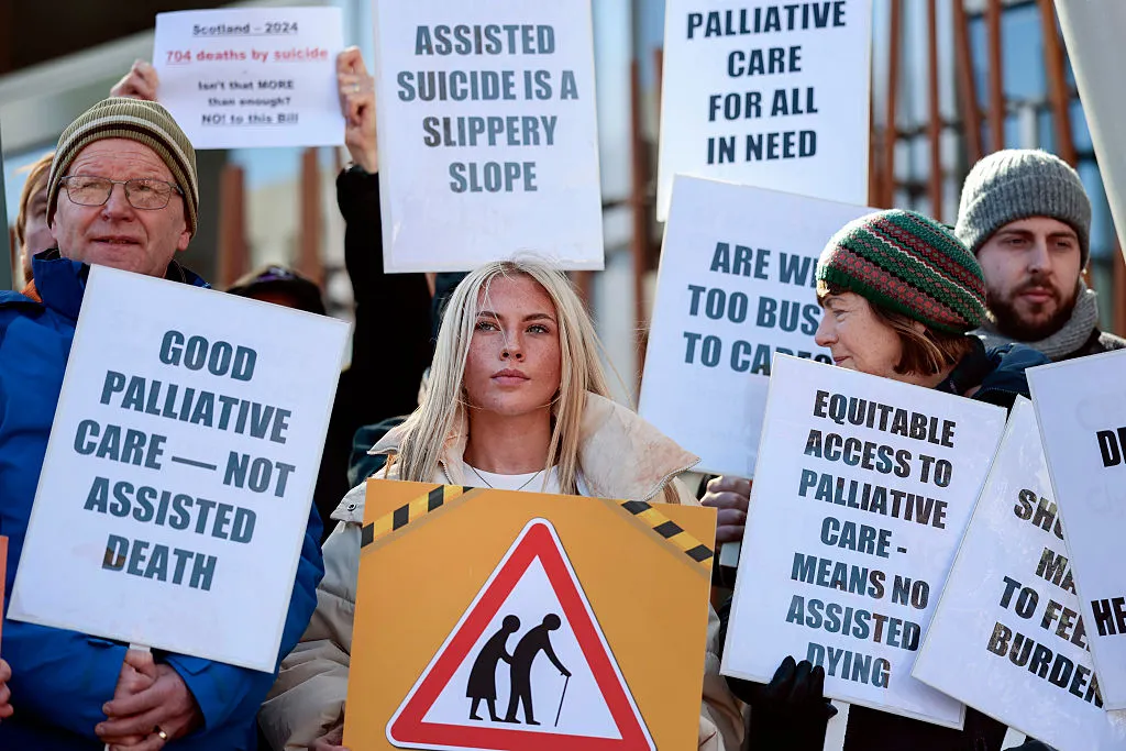Anti assisted-dying demonstrators gather outside Scottish Parliament on March 17, 2026.