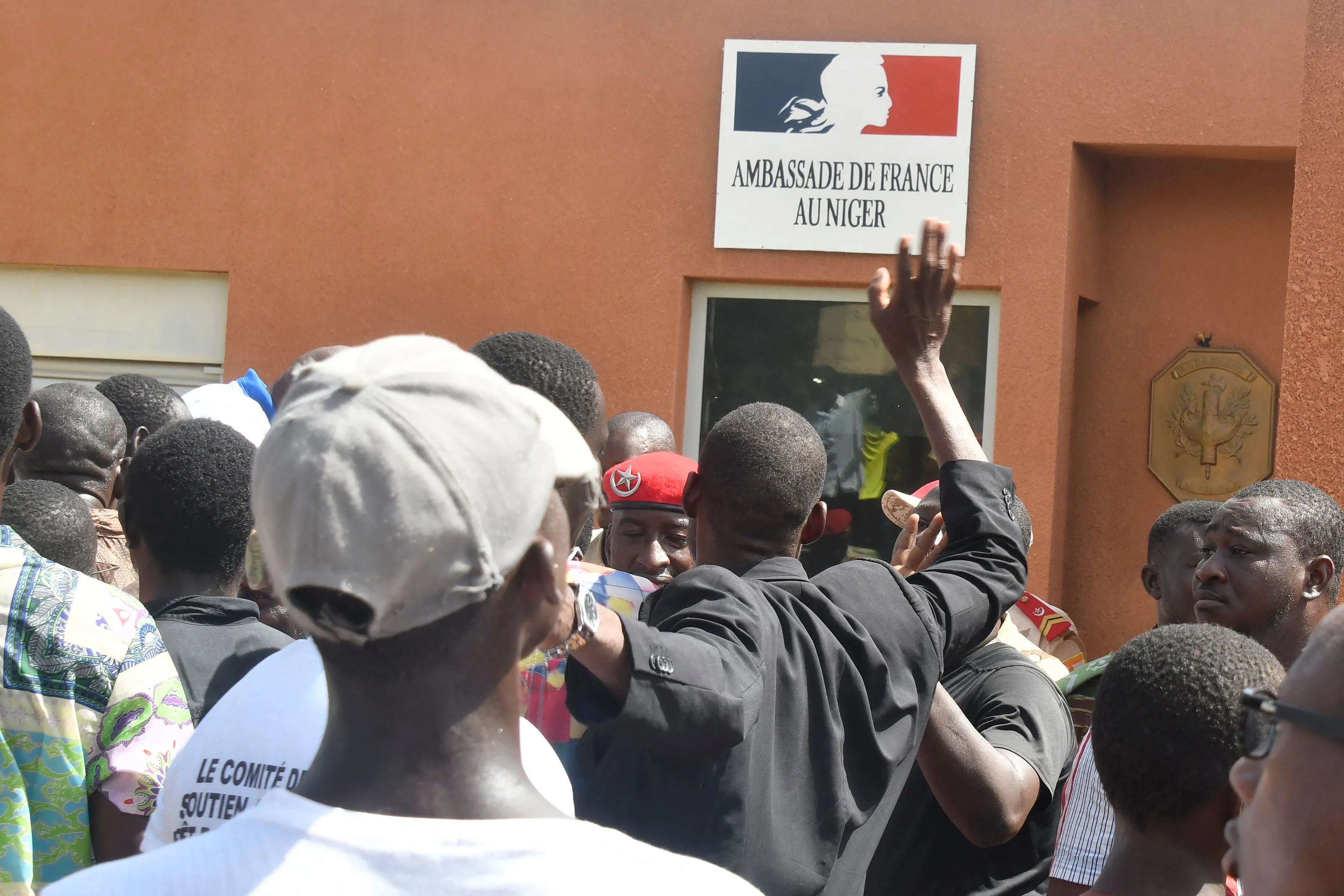 Protesters gather in front of the French Embassy in Niamey, Niger.&nbsp;