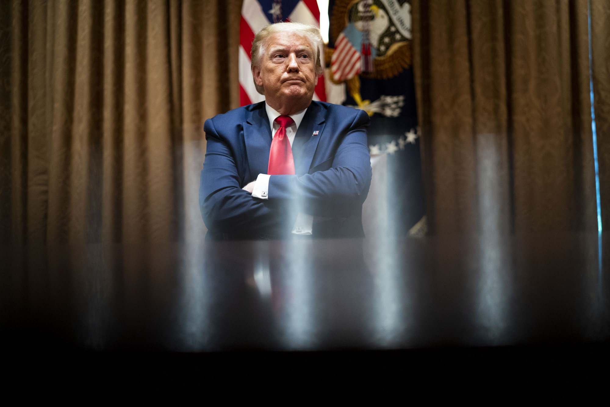 U.S. President Donald Trump sits during a meeting with African-American supporters at the White House on June 10.