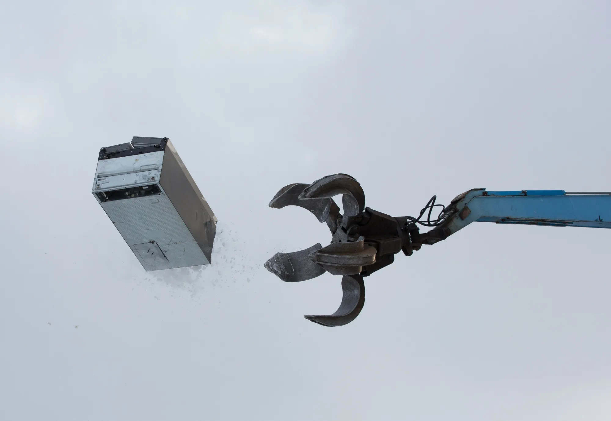 A claw crane tosses a scrapped refrigerator in the yard at the Petromax JSC waste recycling complex, operated by Kuusakoski Group Oy, in Lobnya, outside Moscow, Russia, on Thursday, Jan. 23, 2020.&nbsp;