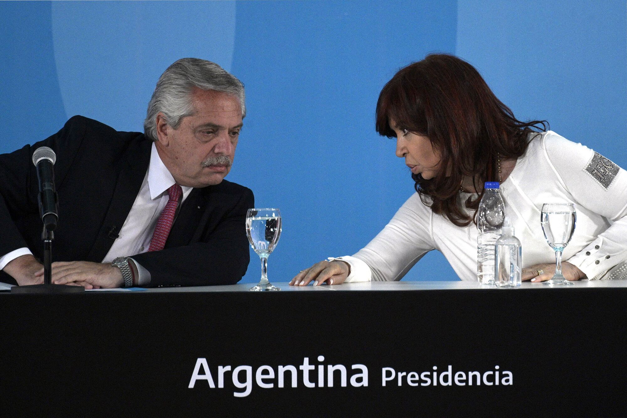 Alberto Fernandez and Cristina Fernandez de Kirchner talk during the presentation of a bill at Casa Rosada in Buenos Aires on Sept. 30, 2021.