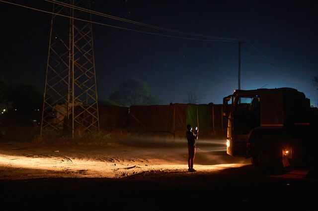 A driver makes a video call at a truck stop just outside the Kazungula border. 