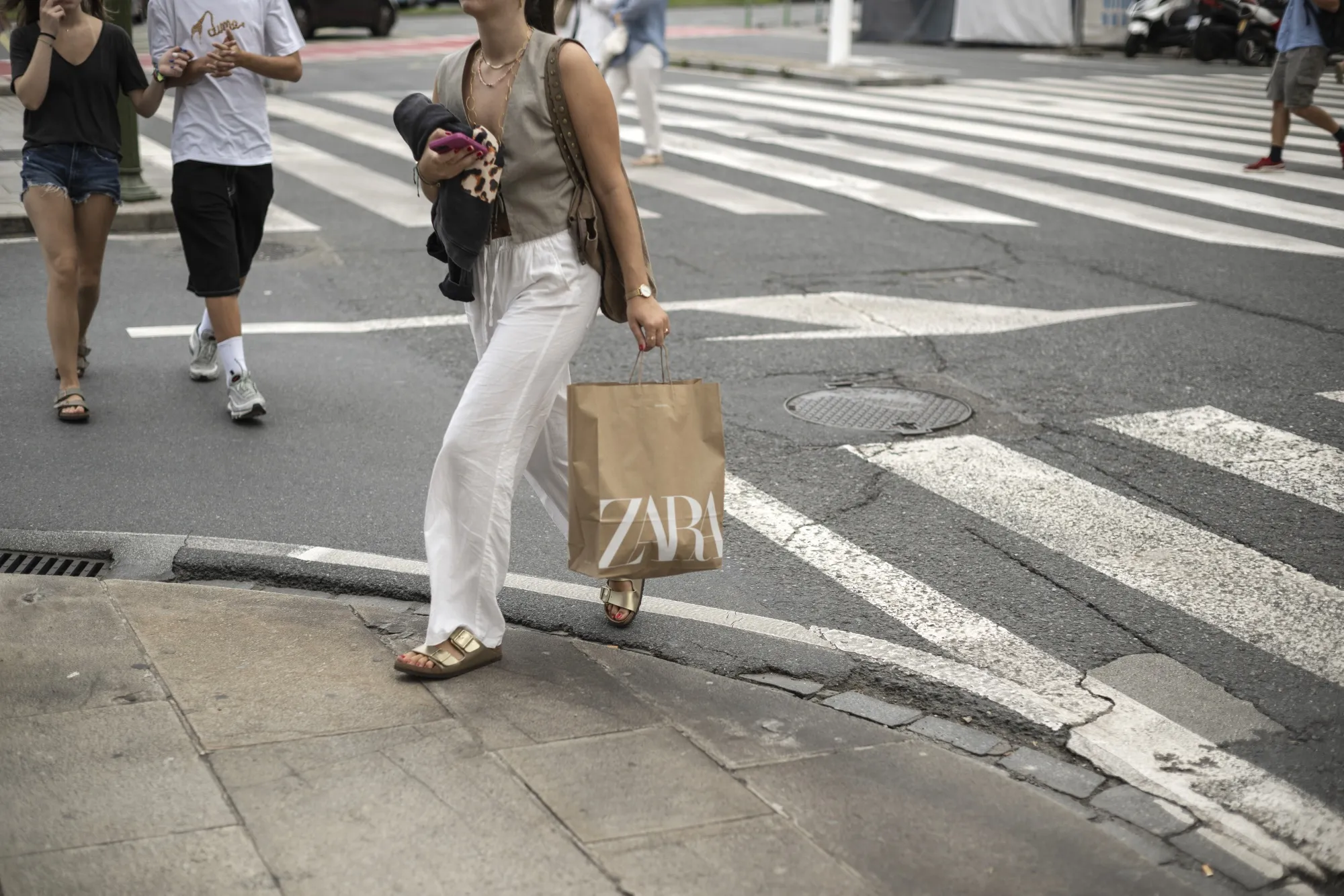 A shopper carries a Zara bag in A Coruna, Spain.