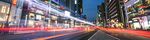 Light trails from passing traffic illuminate a road at night in the Gangnam district of Seoul, South Korea.