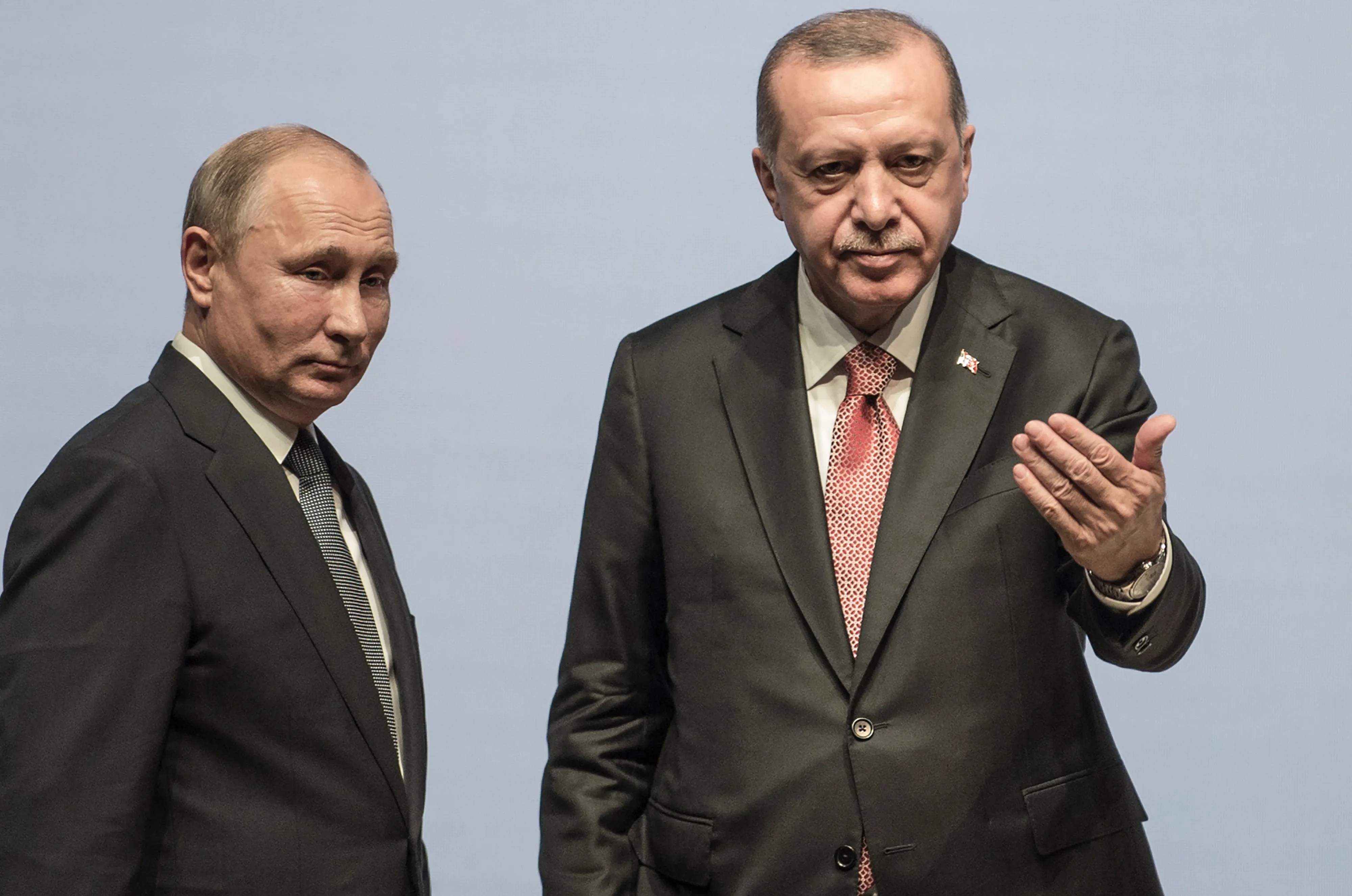 Only one of them is holding the cards.