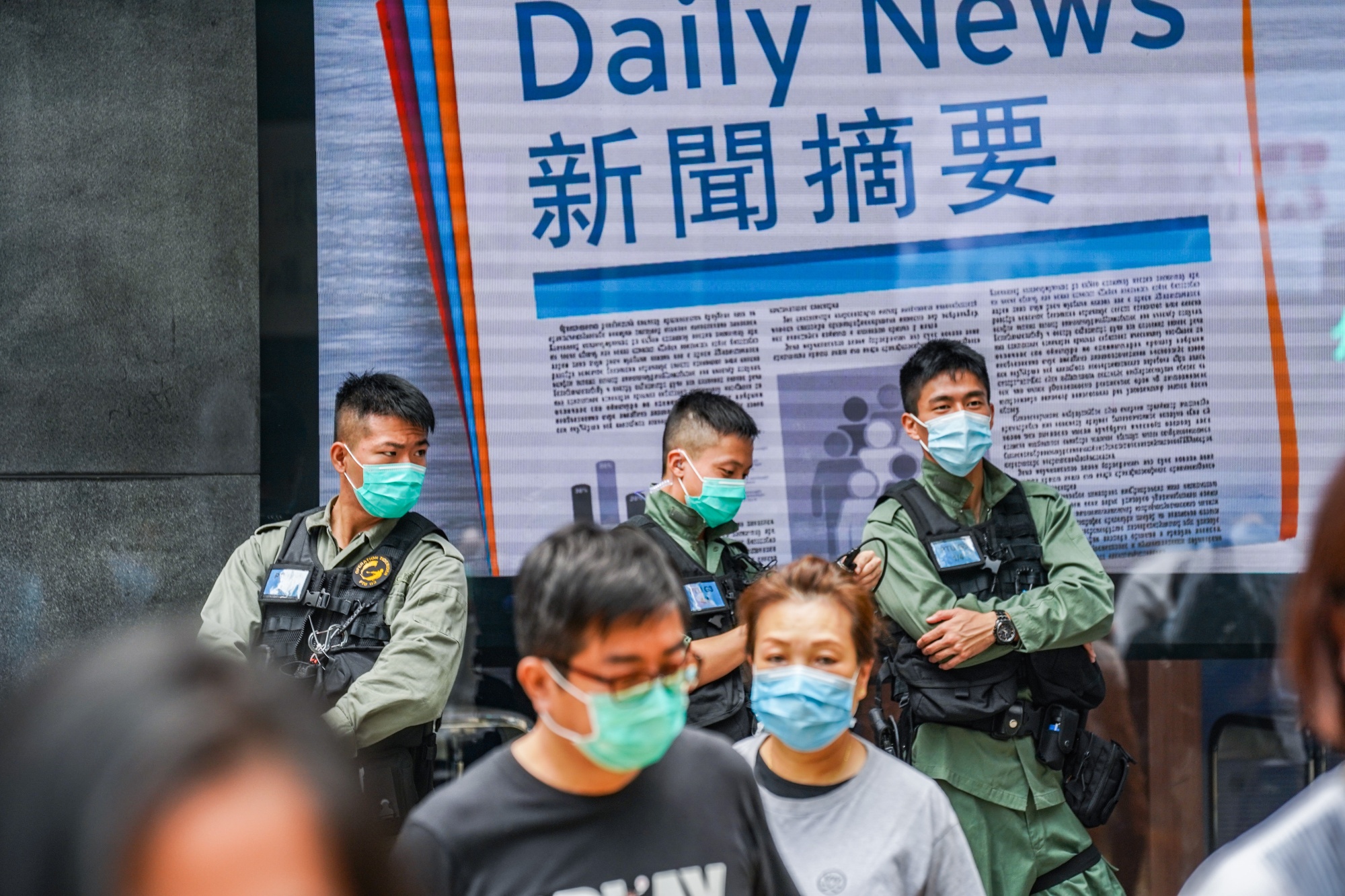 Riot police stand guard in the Central district ahead of an anticipated lunchtime protest in Hong Kong, on May 29.