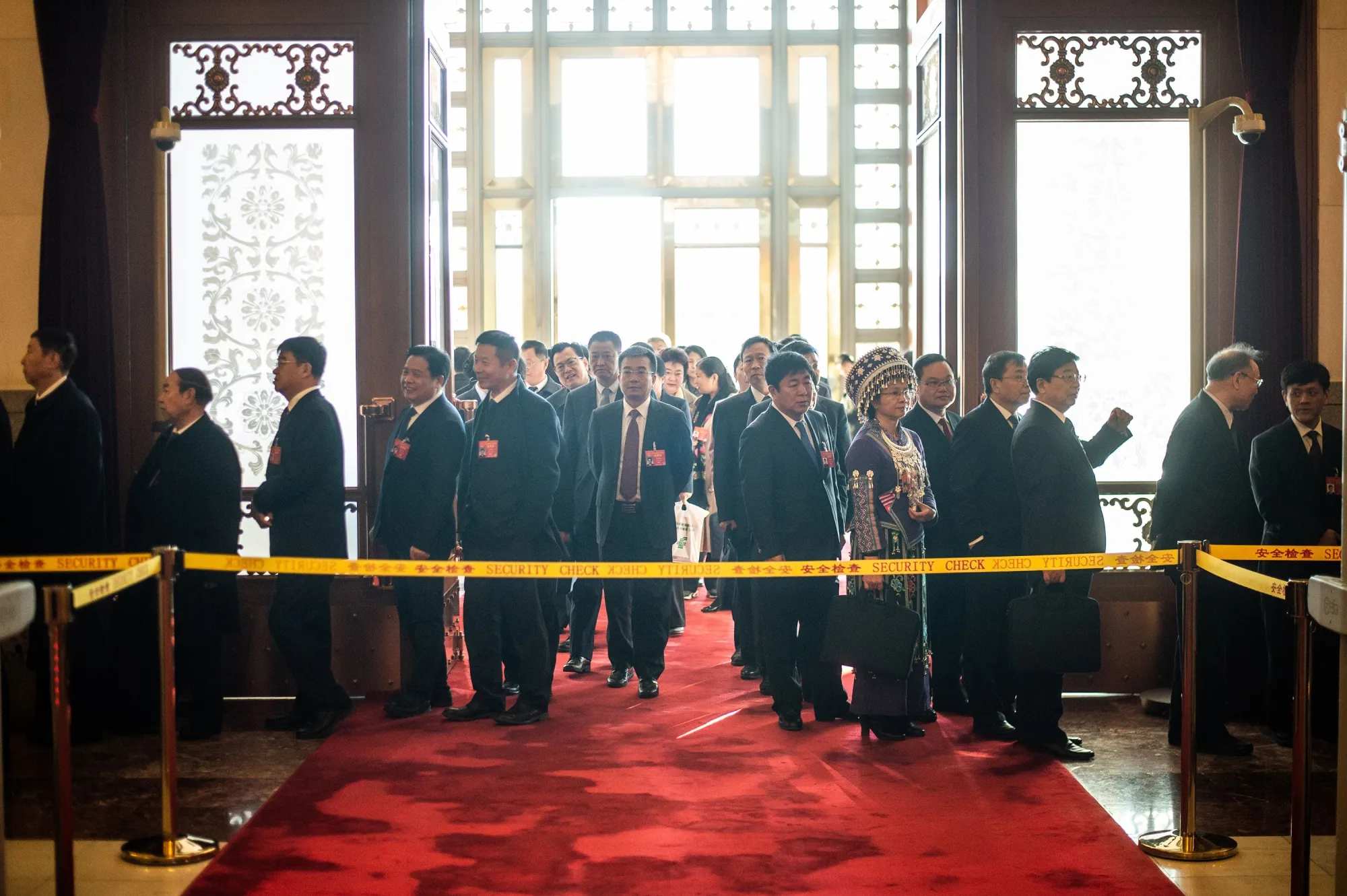 Delegates arrive before the closing session of the National Peoples Congress in Beijing’s Great Hall of the People on March 15, 2019.&nbsp;