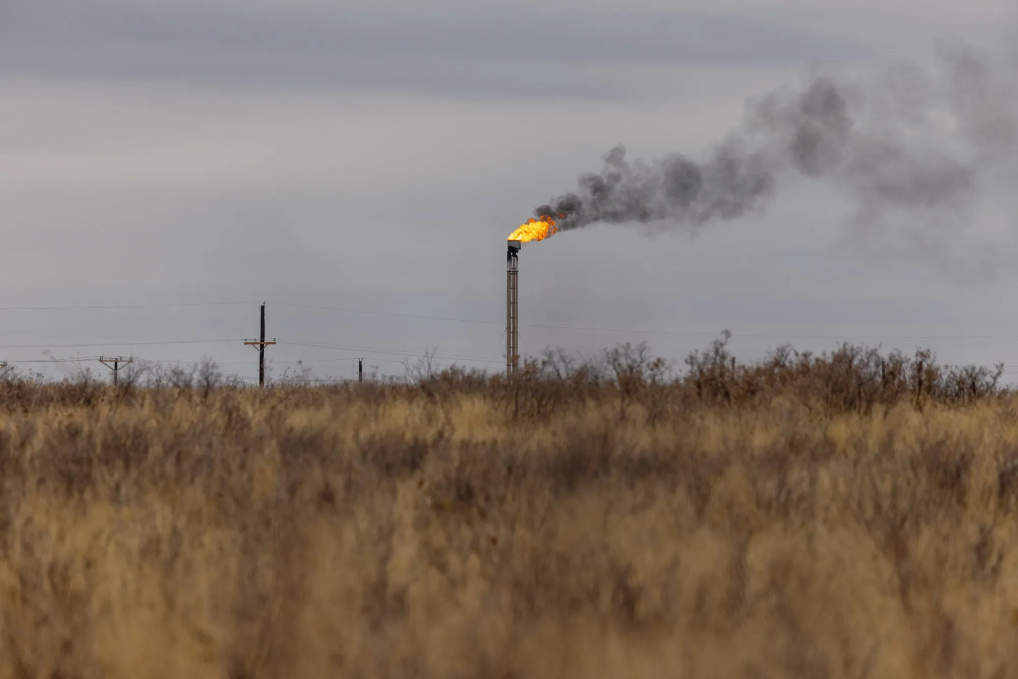 A natural gas flare stack at an oil well in Midland, Texas, U.S. on Monday, April 4, 2022.&nbsp;